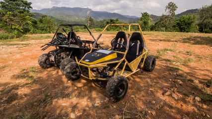 UTV off road four wheel drive sport car driving up the hill to the creek.Driving fun and safety