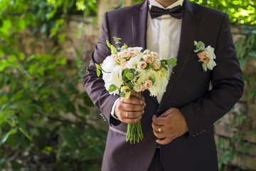 bouquet of flowers. wedding bouquet in hands of the young