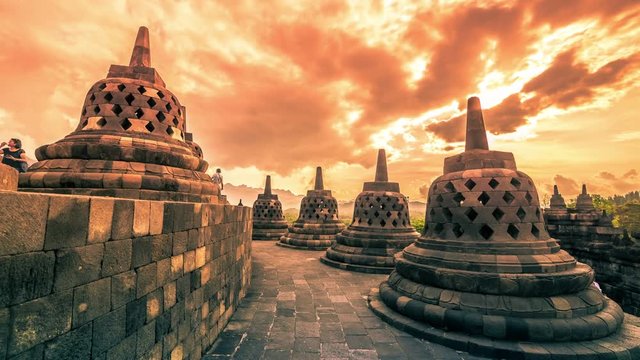 Dramatic and dynamic Sunset at Borobudur Temple of Indonesia. 4K Timelapse - Java, Indonesia, June 2016.