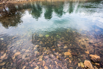 round rock in the river
Water flows from the mountain valleys Forest.Stone made a water slow down.Strength of Water Stone nodular