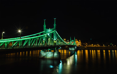 Fototapeta na wymiar Night view of Liberty Bridge in Budapest, Hungary, Pest side of the city