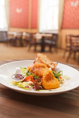 Potato pancakes with vegetable salad and homemade bread.