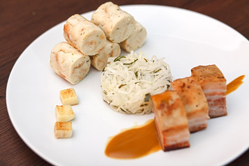 Pork belly with cabbage and bread dumplings.