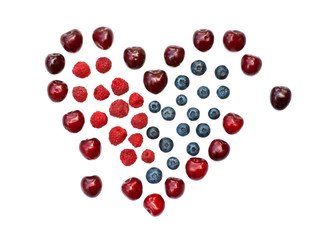 Isolated heart of cherry, blueberry and raspberry on a white background