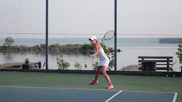 Girl tennis player expecting the tennis ball