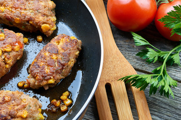 Homemade meat and vegetable cutlets on frying pan