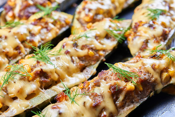 Grilled courgettes stuffed with meat and vegetables © elmowski