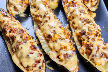Grilled courgettes stuffed with meat and vegetables