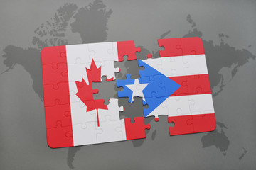 puzzle with the national flag of canada and puerto rico on a world map background.