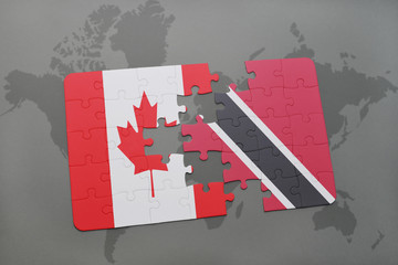 puzzle with the national flag of canada and trinidad and tobago on a world map background.