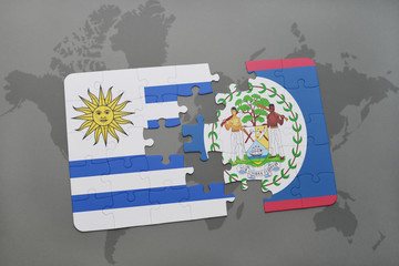 puzzle with the national flag of uruguay and belize on a world map background.