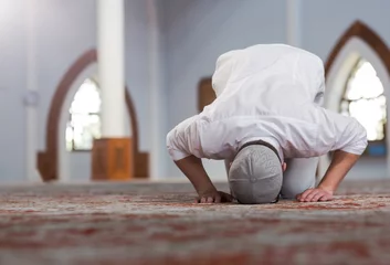 Fotobehang Religious muslim man praying inside the mosque © Myvisuals