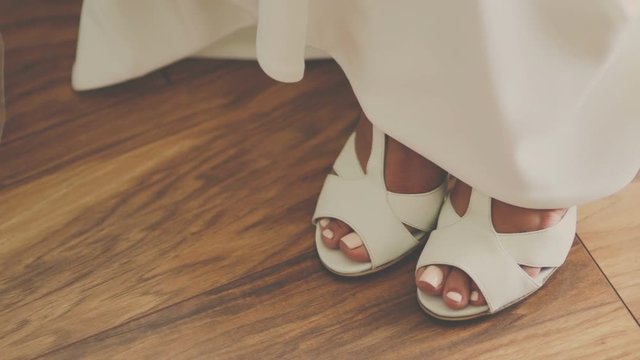 Close up of a brides wedding shoes