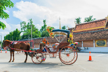 Fototapeta premium Traditional Horse Carriage ride in Wat Phra That Lampang Luang ,