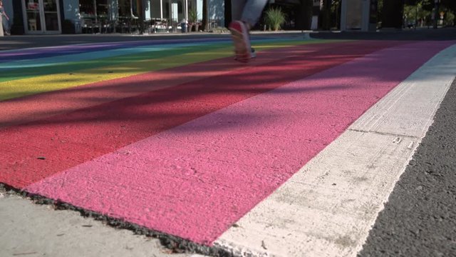 Pride Crosswalk dolly shot, Vancouver BC 4K, UHD. Dolly shot of pedestrians and vehicles at the rainbow colored crosswalk in downtown Vancouver. Canada.
