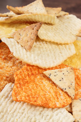 Heap of salted crisps and cookies, concept of unhealthy food