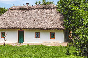 Fototapeta na wymiar Ancient hut with straw roof
