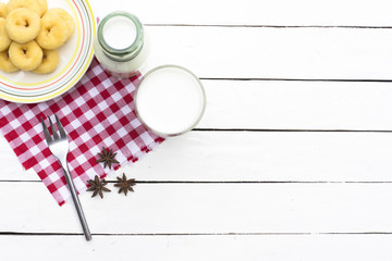 Donut dessert and milk bottle and milk glass on Red checkered fabric .Meal or breakfast hi-vitamin and calcium