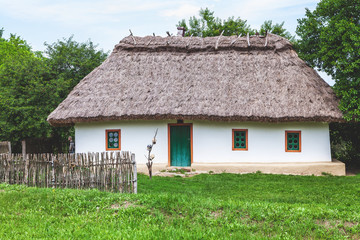 Fototapeta na wymiar Old Ukrainian hut with three windows