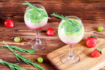 Healthy Layered smoothie made from strawberry, kiwi, bananas. Selective focus