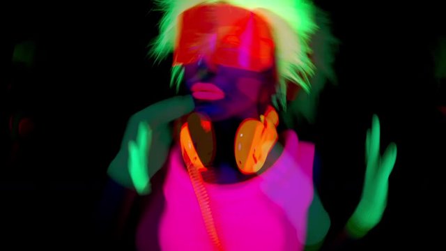 cyber dancer in fluorescent clothing UV glow