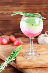 Healthy Layered smoothie made from strawberry, kiwi, bananas. Selective focus
