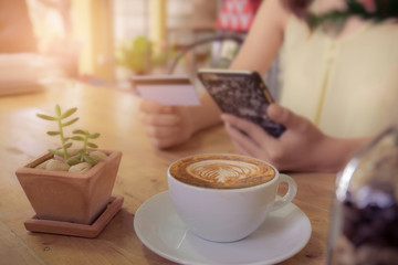 Online payment, Women's hands holding a credit card and using sm