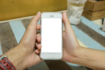 Close up of a man and woman holding smart phone with blank mobil
