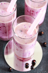 Healthy smoothie made from European black currant in a tall glas
