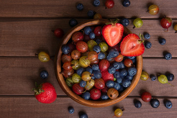 Fresh Berries on Wooden Background