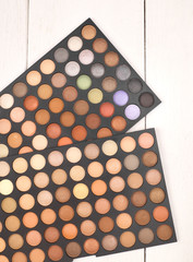 big eye shadow palette on white wooden background