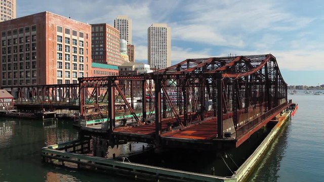 Boston skyline and Northern Avenue Bridge. Built in 1908, it was closed to vehicle traffic in 1999