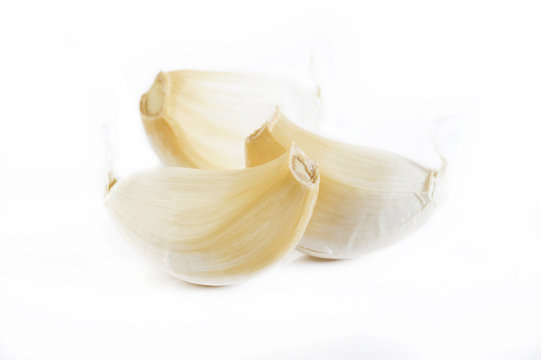 garlic cloves on white background