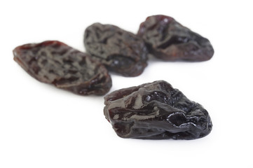 Dried raisins on white background