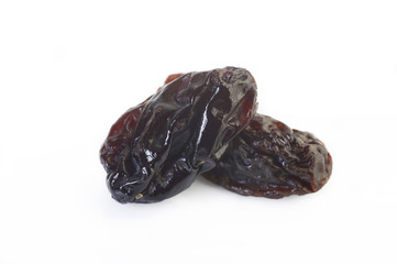 Dried raisins on white background