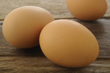 Eggs on wooden background