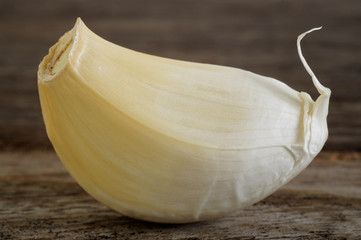 garlic cloves on wooden background