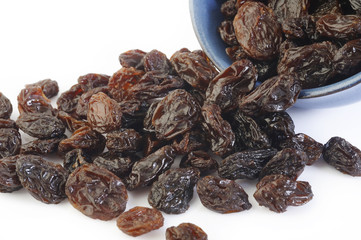Dried raisins on white background