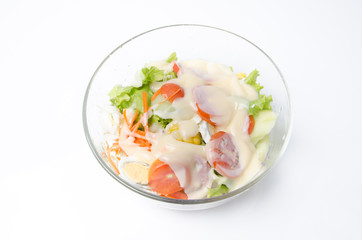 Fresh vegetable salad isolated on white ground.