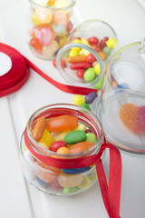 Multicolor candies in glass jars
