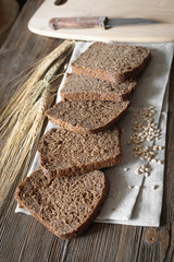 pieces of bread on a board with shallow depth of field