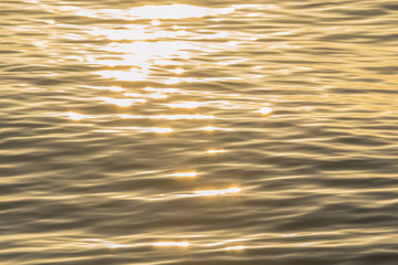 golden color water ripples.
