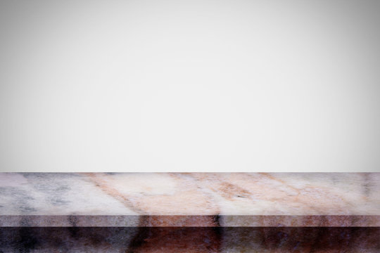 Empty top of natural marble table with white gray gradient wall