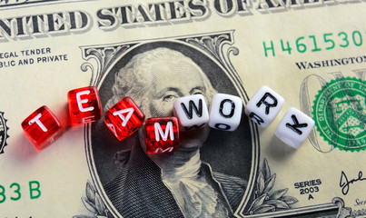 teamwork text  on dollar banknote