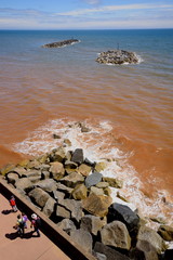Beach during low tide in Sidmouth, Devon is part of Jurassic Coast which was awarded World Heritage...