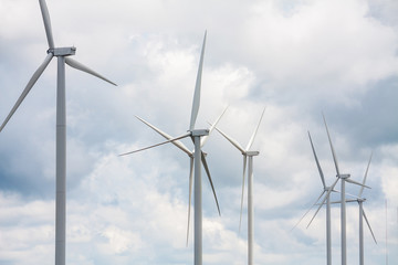 Fototapeta premium Wind turbines with the clouds and sky