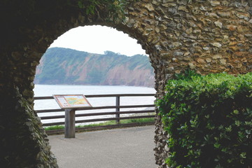 Arch of Sidmouth Castle with sea view