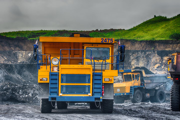 Big yellow mining truck at worksite
