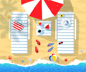 Sun beds and parasol on seaside
