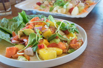 Vegetable salad with salmon.